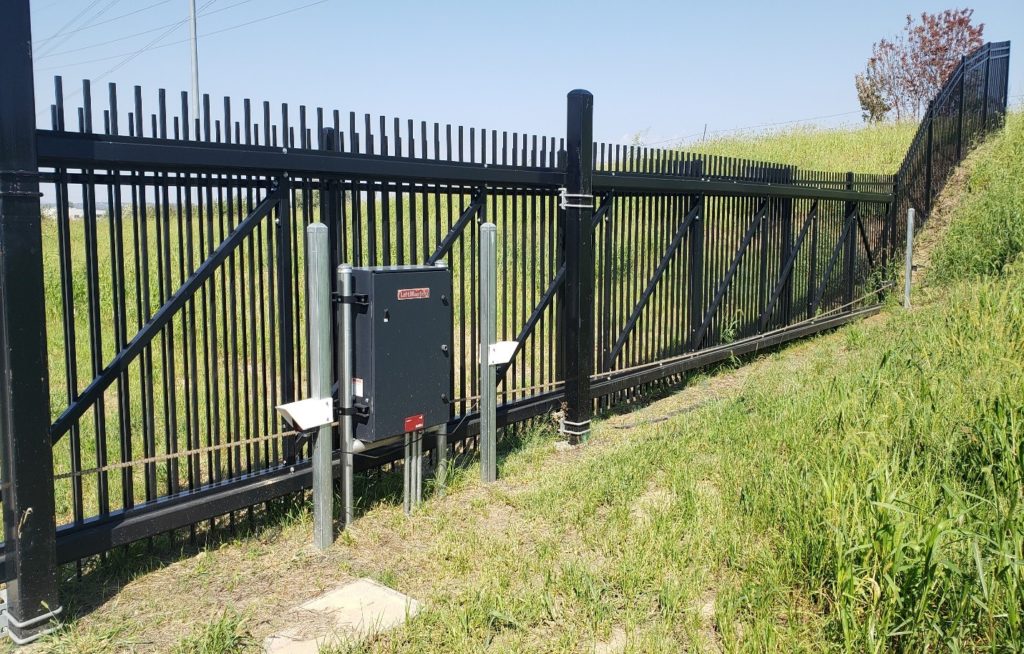 A photo eye cover installed on either side of a gate operator
