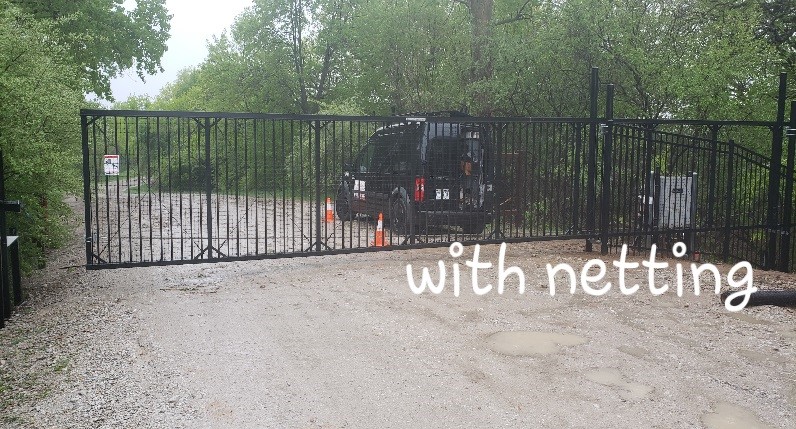A ornamental sliding gate with 2 1/4" picketing spacing with netting installed