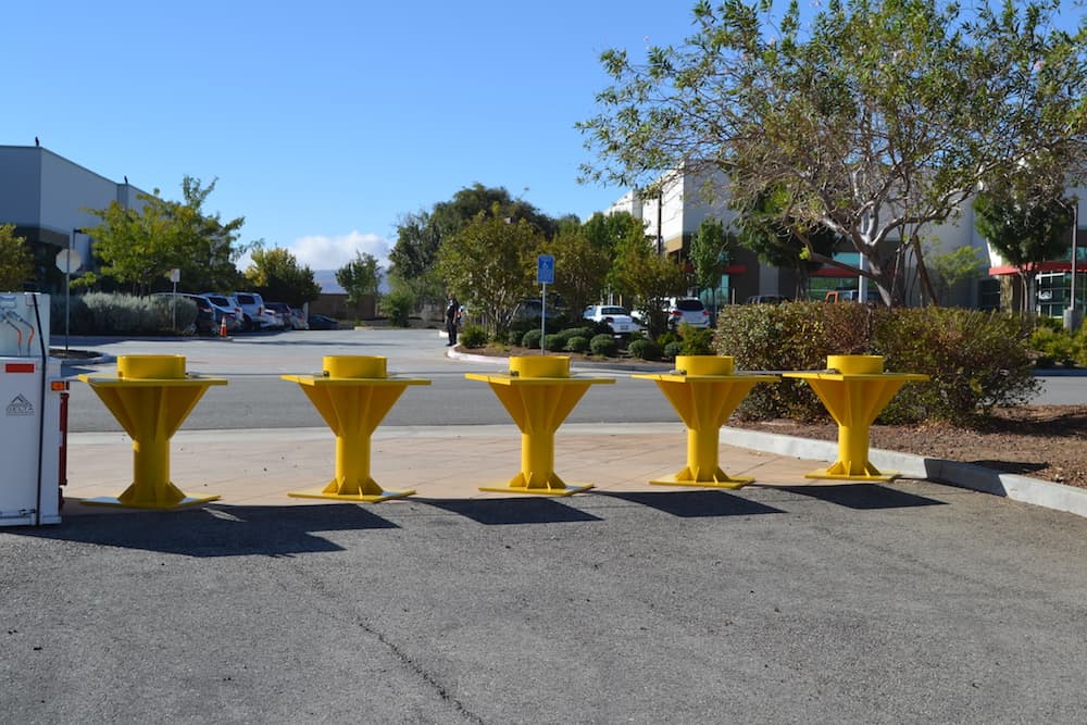 Cone shaped portable bollards. 

Traffic barriers security access control portable bollards high visibility restricting access