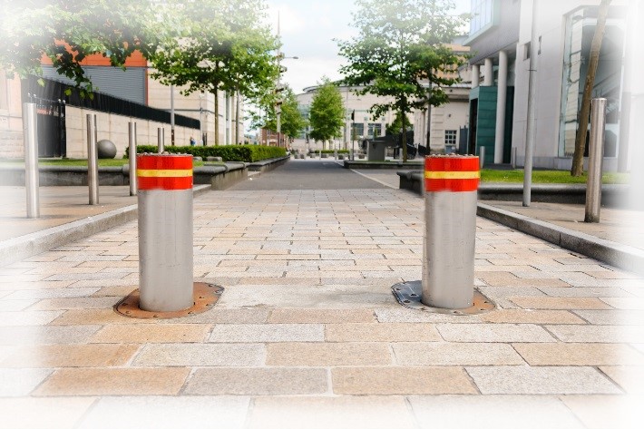 Two static crash rated bollards in the restricted area of a public road