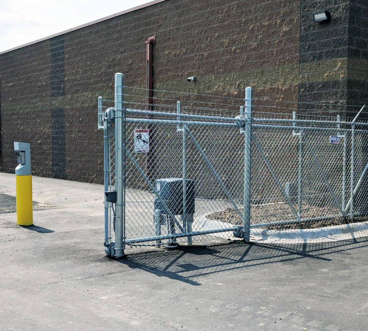 Chain link cantilever gate with barb wire and a slide gate operator.

Commercial automated electric gate opener operators commercial gate installation motorized automatic access control driveway estate slide swing rolling cantilever vertical lift vertical pivot open close stop key pad switch push button three button control computerized entry loop exit obstruction shadow detector transmitter receiver radio frequency wifi linear box cantilever aluminum gate installation contractors