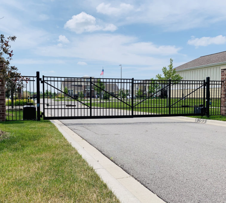 Closed black ornamental automatic double swing gate with operators.

access control commercial gate installation company automated electric gate opener operators solar motor motorized automatic access control driveway estate slide swing rolling cantilever vertical lift vertical pivot open close stop key pad switch push button three button control intercom call button telephone entry computerized entry loop exit obstruction shadow detector transmitter receiver radio frequency wifi box cantilever aluminum 