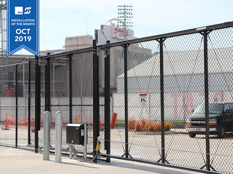 Installation of the Month of October, 2019 for HySecurity. Featured is a black chain link cantilever gate with the SlideSmart HD25 gate operator installed